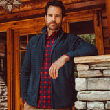Man wearing Apex Full Zip over a woven shirt