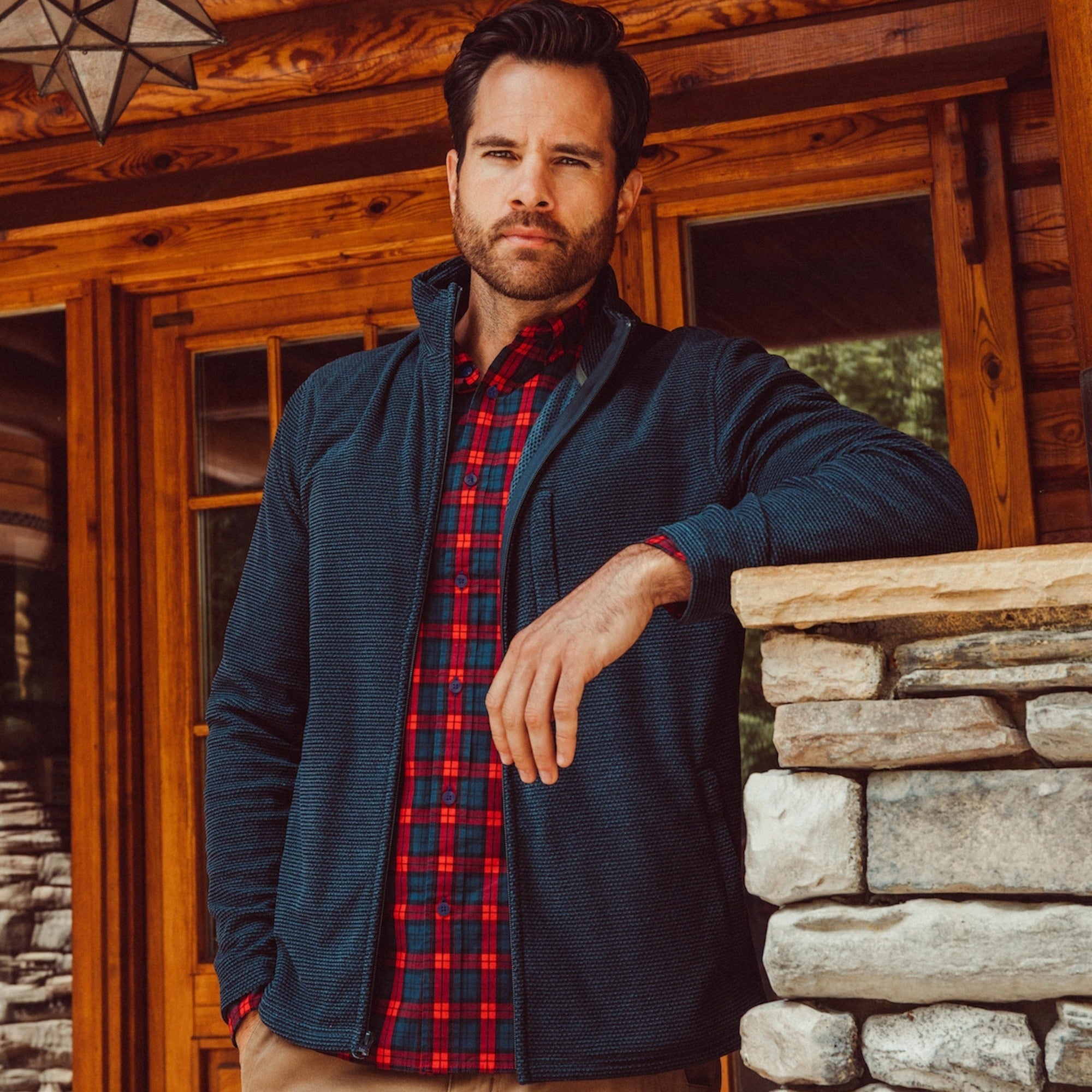 Man wearing Apex Full Zip over a woven shirt