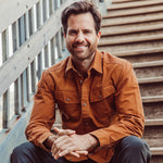 Man wearing Hamilton Chamois Shirt sitting on the stairs