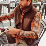 Man wearing Forge Vest eating outdoor