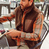 Man wearing Forge Vest eating outdoor