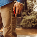 Man wearing Alpine Work Pant walking outdoor