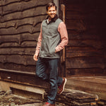 A man wears Sullivan Ranch Vest standing outdoor