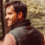 A man wears Sullivan Ranch Vest standing outdoor
