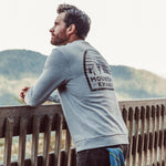 Man wearing Mountain Logo Crew standing outside