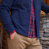 Man wearing Apex Full Zip over a woven shirt