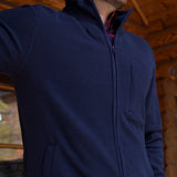 Man wearing Apex Full Zip over a woven shirt