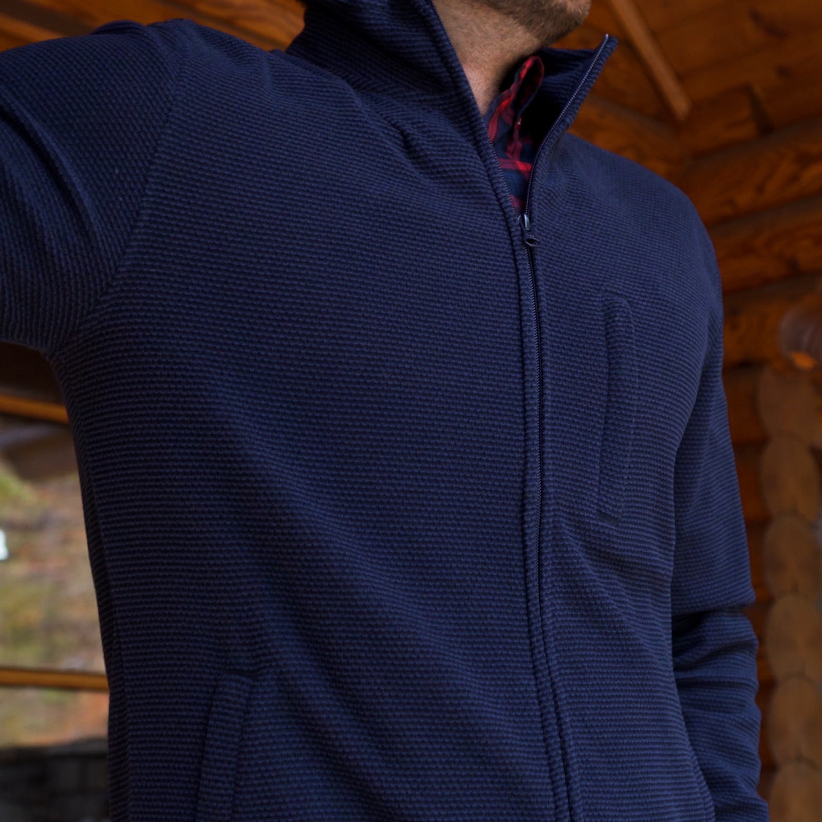Man wearing Apex Full Zip over a woven shirt