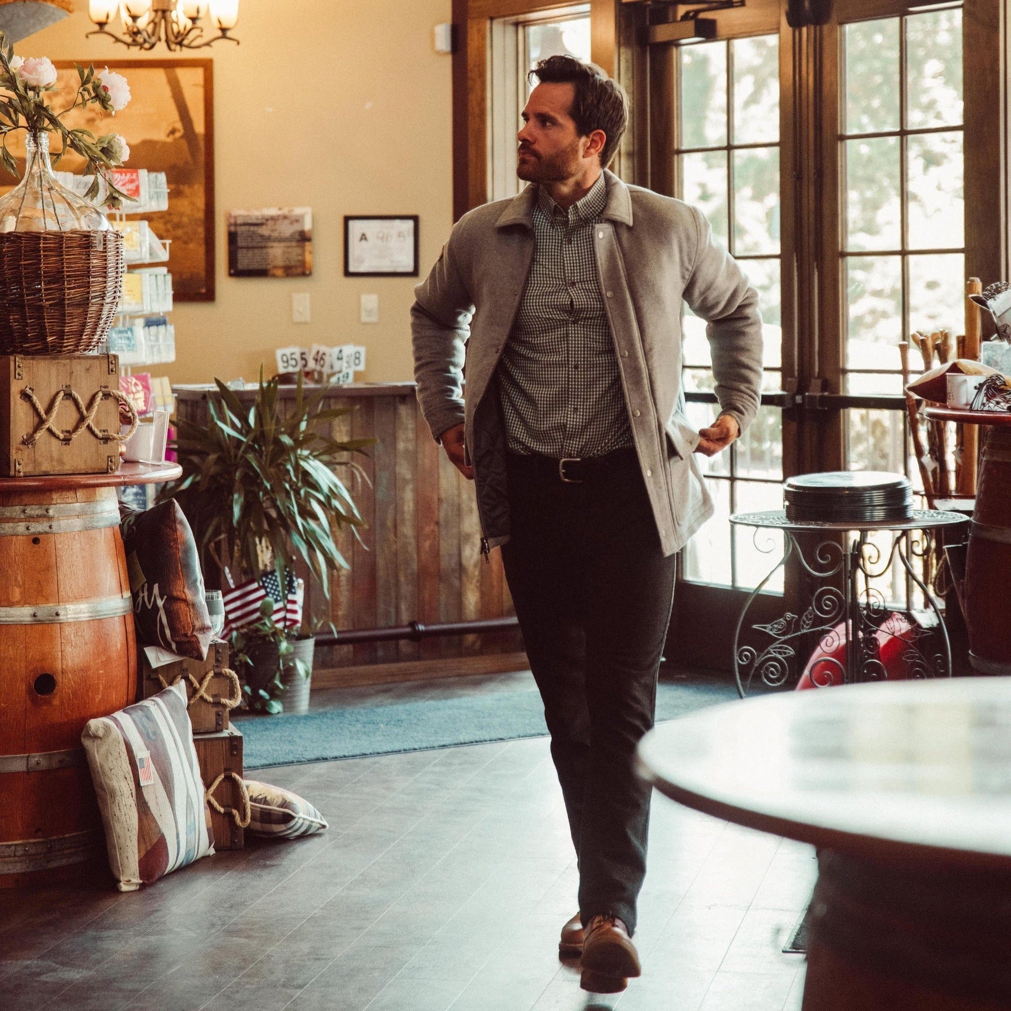 Man wearing Dover Wool Jacket and walking into a store