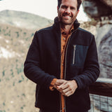Man wearing Forge Jacket standing outside