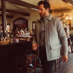 Man wearing Dover Wool Jacket and walking into a store