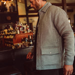 Man wearing Dover Wool Jacket and walking into a store