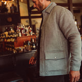 Man wearing Dover Wool Jacket and walking into a store